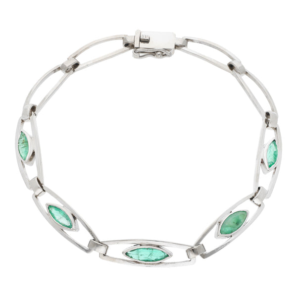 Pulsera eslabón articulado con esmeraldas en oro blanco 14 kilates.