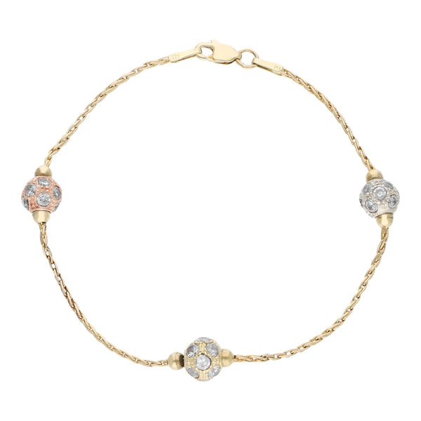 Pulsera eslabón trenzado con aplicaciones de esferas con circonias en oro tres tonos 14 kilates.