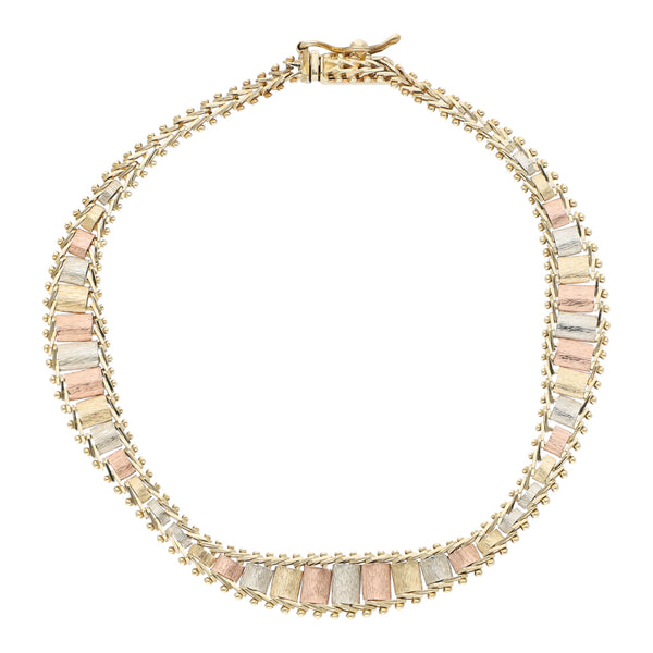 Pulsera eslabón boleado en oro tres tonos 14 kilates.