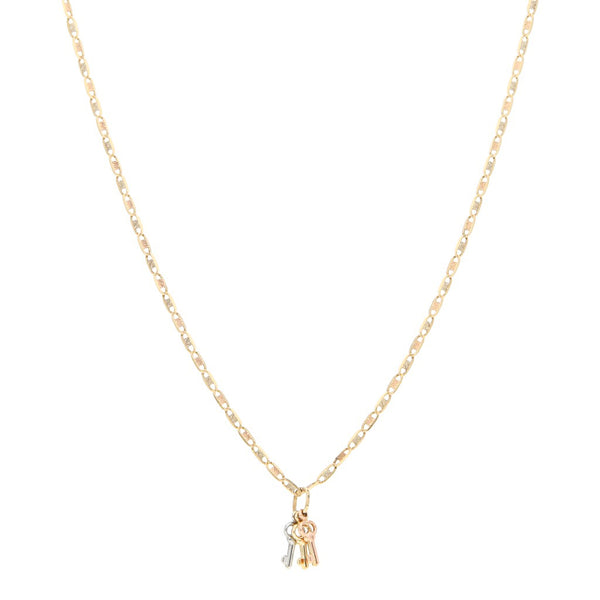 Collar eslabón nudo marino y dije diseño especial motivo llaves en oro tres tonos 14 kilates.