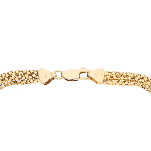 Pulsera de tres hilos eslabón laminado con aplicaciones en oro amarillo 14 kilates.