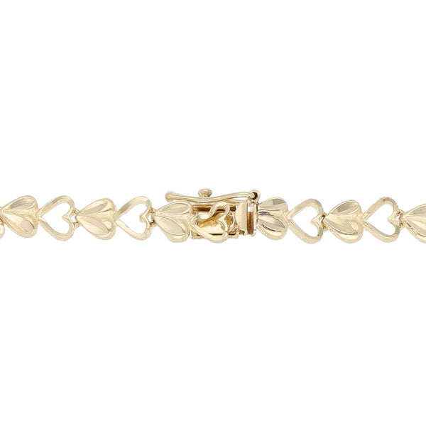 Pulsera eslabón encontrado motivo corazón en oro amarillo 14 kilates.