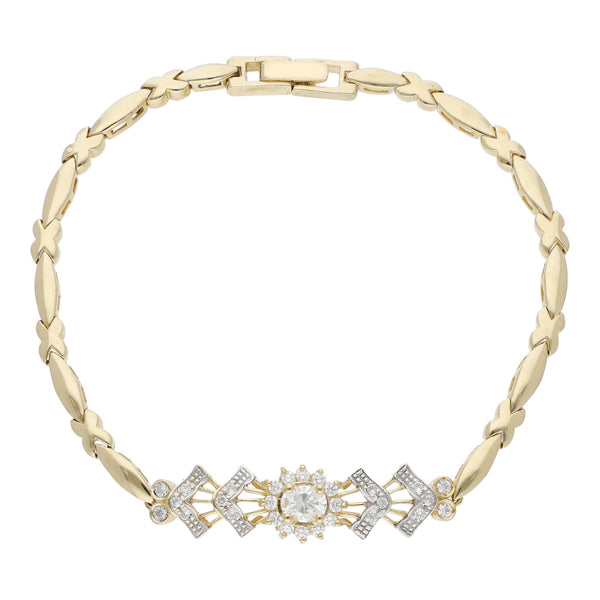 Pulsera eslabón articulado con aplicaciones de circonias en oro amarillo 14 kilates.