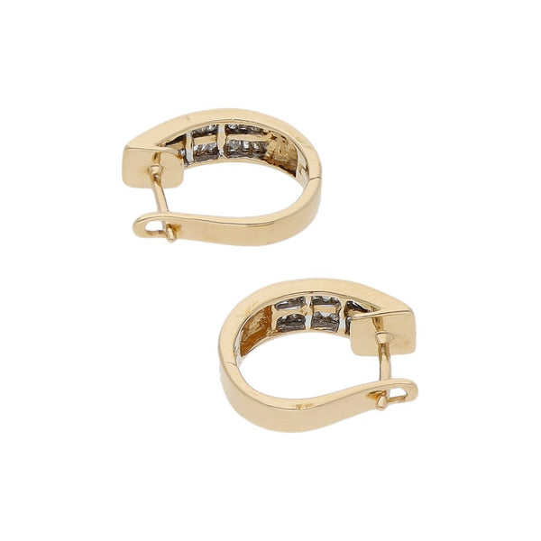 Arracadas articuladas con diamantes en oro amarillo 14 kilates.