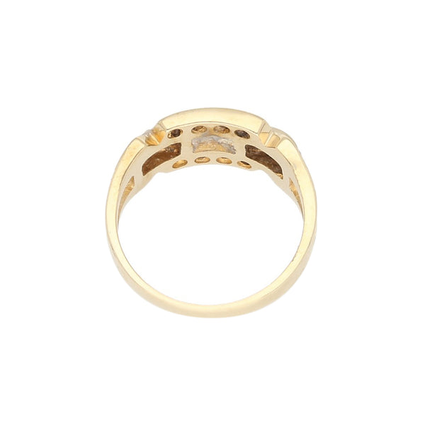 Anillo calado con circonias en oro amarillo 14 kilates.