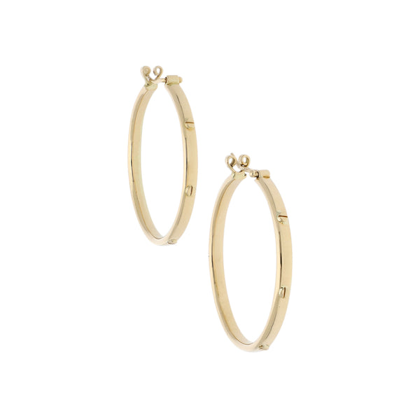 Arracadas huecas en oro amarillo 14 kilates.