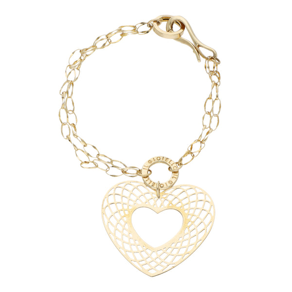 Pulsera de dos hilos eslabón cruzado con aplicación de aro y colgante motivo corazón en oro amarillo 14 kilates.