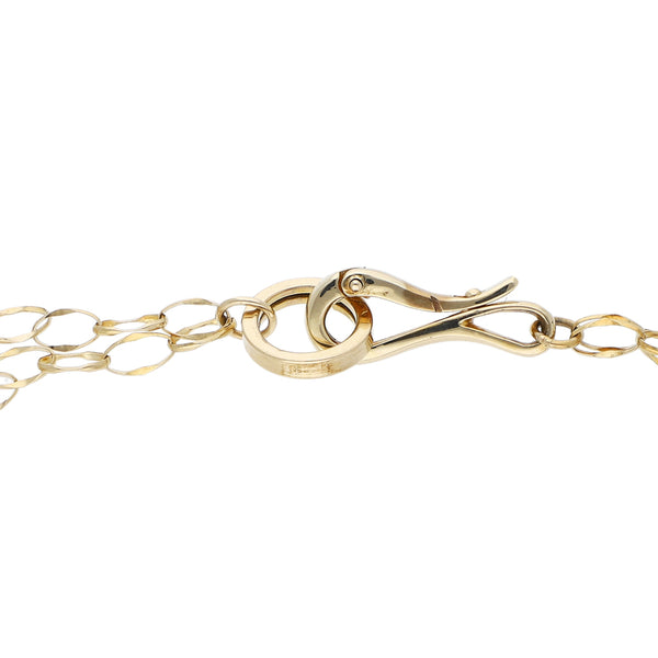 Pulsera de dos hilos eslabón cruzado con aplicación de aro y colgante motivo corazón en oro amarillo 14 kilates.