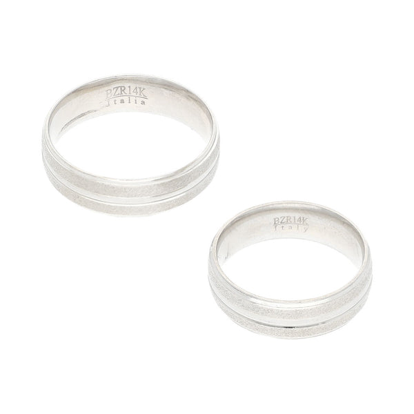 Dos argollas diseño especial en oro blanco 14 kilates.