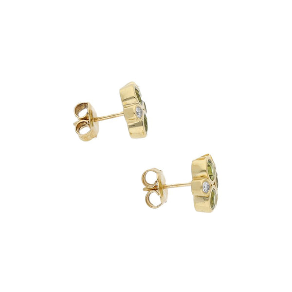 Broqueles diseño especial con diamantes y sintéticos en oro amarillo 18 kilates.