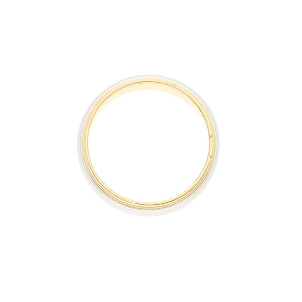 Argolla lisa firma Tiffany & Co. con aplicación de platino 950 en oro amarillo 18 kilates.