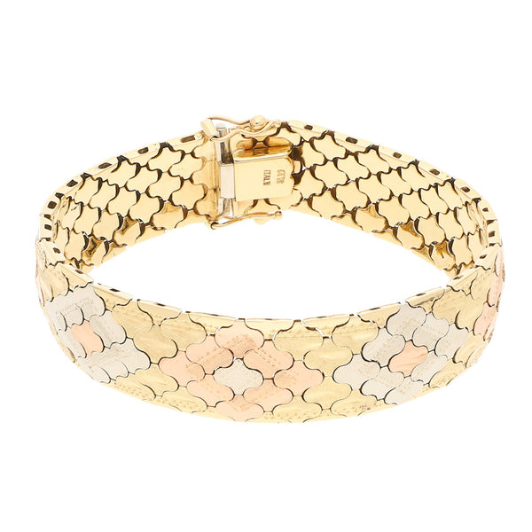 Pulsera eslabón articulado en oro tres tonos 14 kilates.