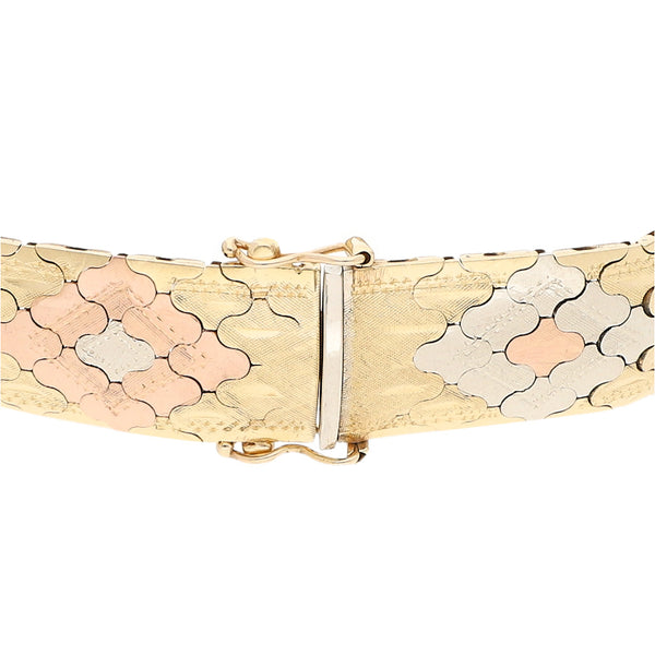 Pulsera eslabón articulado en oro tres tonos 14 kilates.