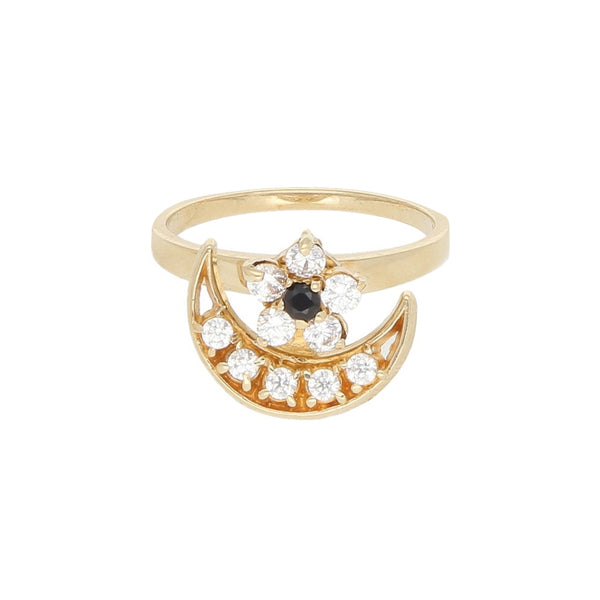Anillo giratorio con sintéticos motivo media luna y flor en oro amarillo 14 kilates.