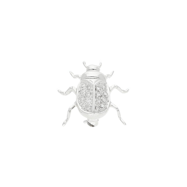 Prendedor estilizado con diamantes motivo escarabajo en oro blanco 14 kilates.