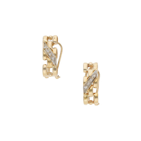 Aretes calados con diamantes en oro amarillo 14 kilates.