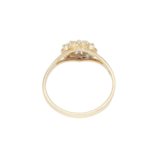 Anillo calado motivo flor con circonias en oro amarillo 14 kilates.