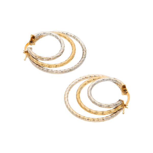 Arracadas diseño especial en oro dos tonos 14 kilates.