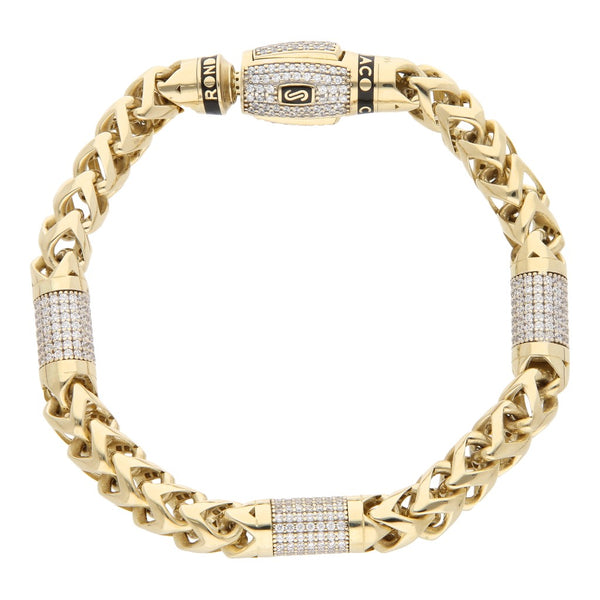Pulsera calada con circonias en oro amarillo 14 kilates.