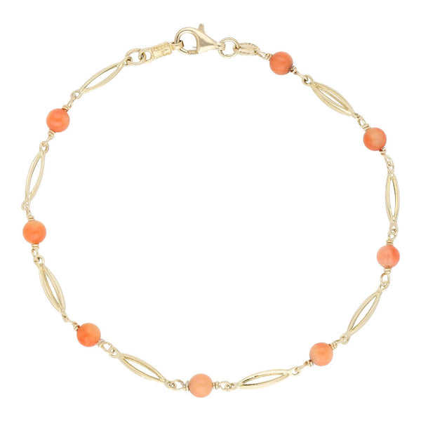 Pulsera eslabón articulado con aplicaciones de coral en oro amarillo 14 kilates.