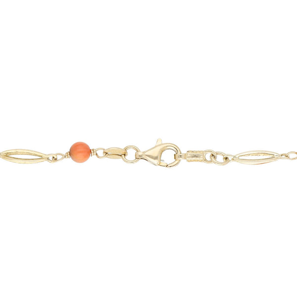 Pulsera eslabón articulado con aplicaciones de coral en oro amarillo 14 kilates.