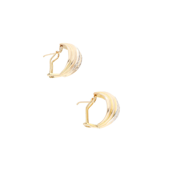 Aretes estilizados con diamantes en oro amarillo 12 kilates.