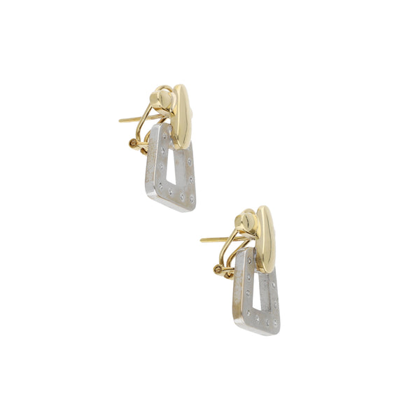 Aretes estilizados con diamantes en oro dos tonos 14 kilates.