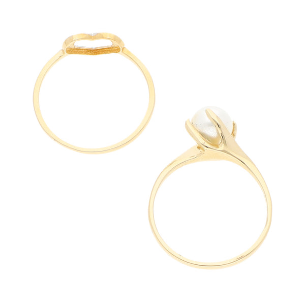 Dos anillos diseño especial motivo corazón con perla en oro amarillo 14 kilates.