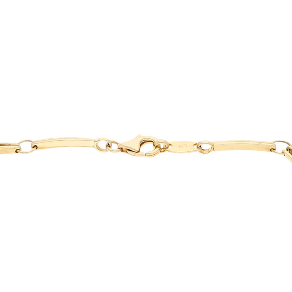 Pulsera eslabón articulado con aplicaciones motivo tortugas y gemas en oro amarillo 14 kilates.