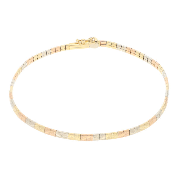 Pulsera eslabón articulado en oro tres tonos 14 kilates.