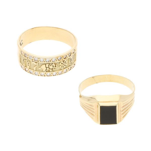 Dos anillos diseño especial uno con circonias motivos de la suerte y uno con ónix en oro amarillo 14 kilates.