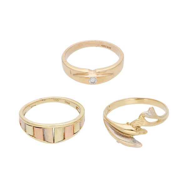 Tres anillos diseño especial uno con circonia en oro tres tonos 14 kilates.