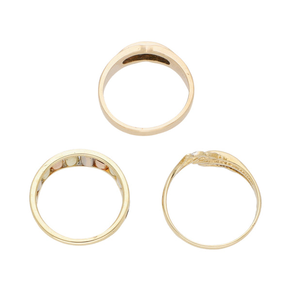 Tres anillos diseño especial uno con circonia en oro tres tonos 14 kilates.