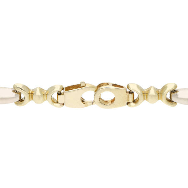 Pulsera eslabón articulado en oro dos tonos 14 kilates.