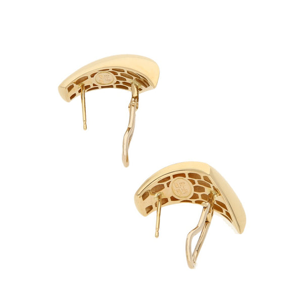 Juego de anillo y aretes estilizados en oro amarillo 14 kilates.