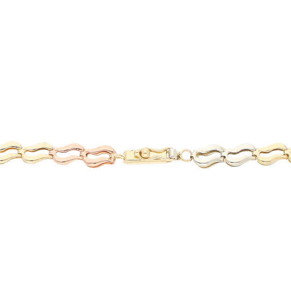 Pulsera calada en oro tres tonos 14 kilates.