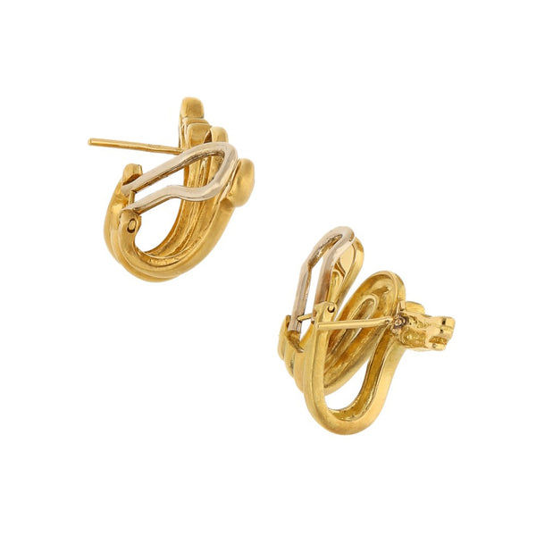 Aretes estilizados firma H. Stern motivo dragones con diamantes en oro amarillo 18 kilates.