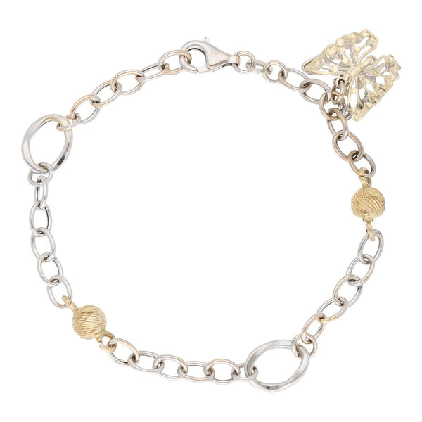 Pulsera eslabón combinado con aplicaciones y colgante motivo esferas y mariposa en oro dos tonos 14 kilates.