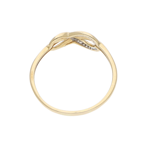 Anillo calado motivo infinito con diamantes en oro amarillo 14 kilates.