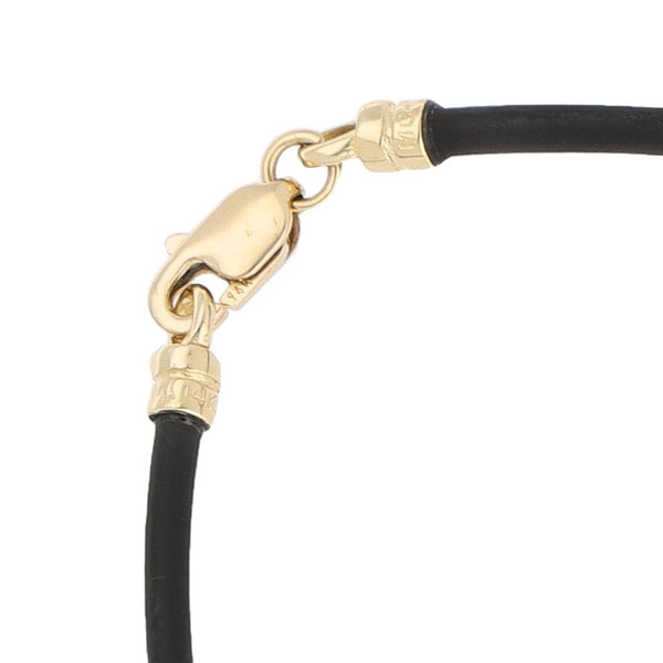 Pulsera de caucho con aplicación motivo oso de sintéticos y casquillos en oro amarillo 14 kilates.