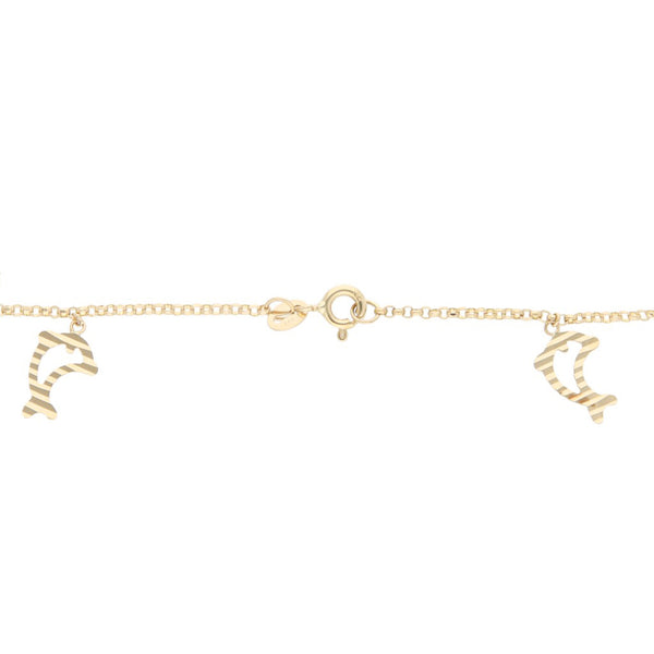 Pulsera eslabón cruzado con colgantes motivo corazón y delfín en oro tres tonos 14 kilates.