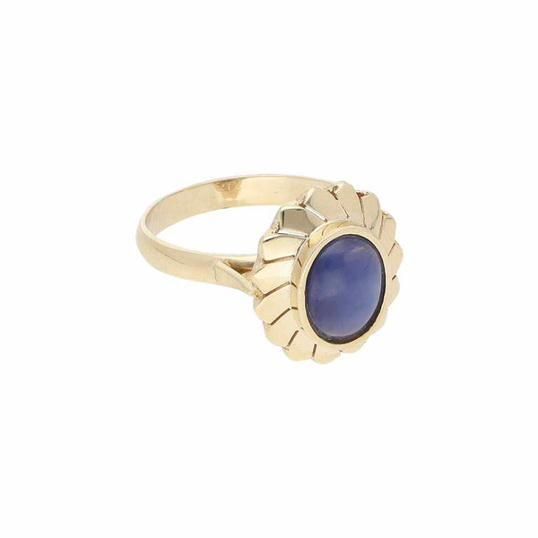 Anillo diseño especial con zafiro estrella en oro amarillo 14 kilates.