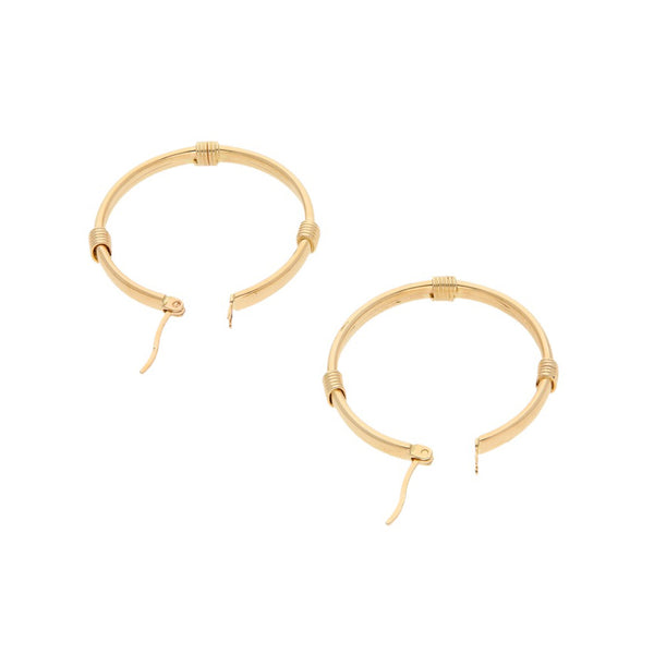 Arracadas huecas en oro amarillo 14 kilates.