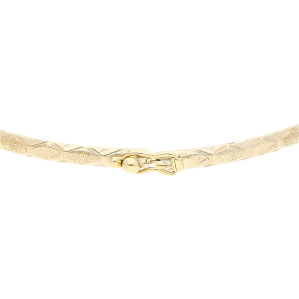 Pulsera de arillo facetada en oro amarillo 12 kilates.