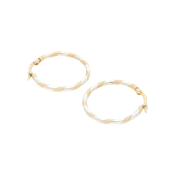 Arracadas torzales platinadas en oro amarillo 14 kilates.