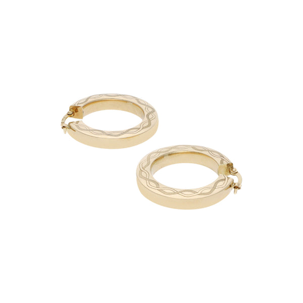 Arracadas huecas en oro amarillo 14 kilates.