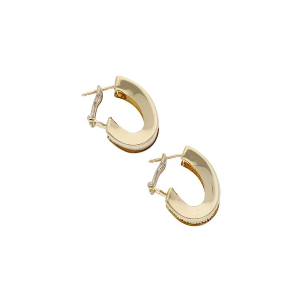 Aretes diseño especial en oro amarillo 14 kilates.