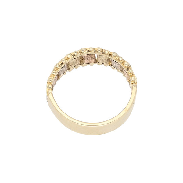 Anillo boleado en oro tres tonos 14 kilates.