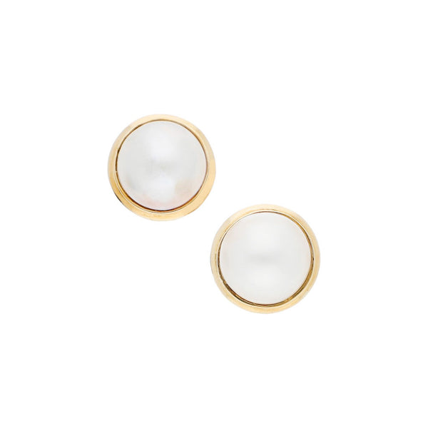 Aretes diseño especial con media perla en oro amarillo 14 kilates.