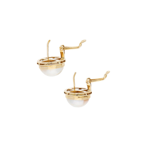 Aretes diseño especial con media perla en oro amarillo 14 kilates.
